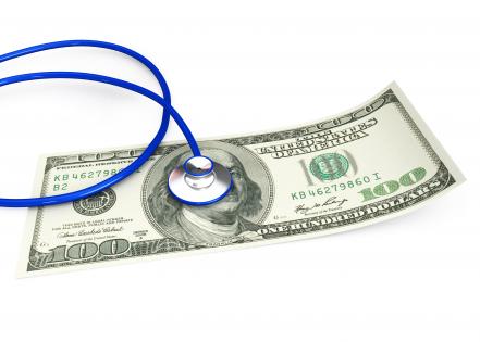 0914 stethoscope on 100 dollar note for checking stock photo
