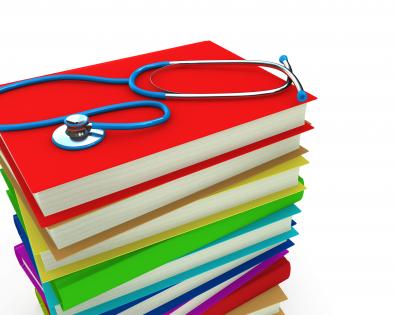 0914 stethoscope on stack of books for medical study stock photo