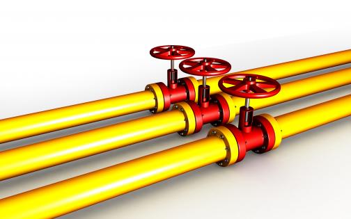 0914 yellow pipelines with red valves in center stock photo