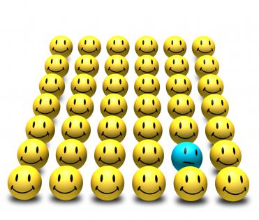 0914 yellow smileys with single blue smiley image slide stock photo