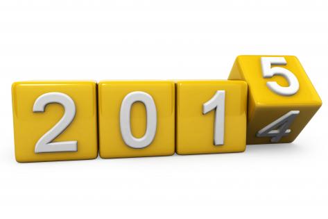 0914 yellow turning cubes for new year 2015 stock photo