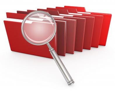 1114 red computer folders with magnifying glass stock photo