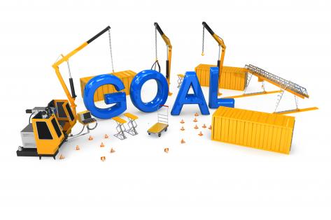 Blue letters of goal with construction equipment stock photo