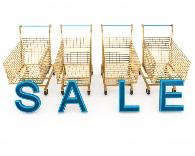 Blue letters of sale with four shopping carts stock photo