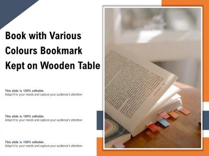 Book with various colours bookmark kept on wooden table