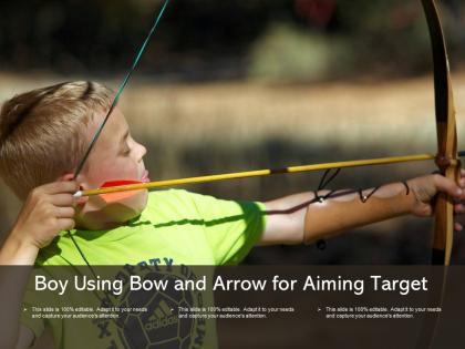 Boy using bow and arrow for aiming target