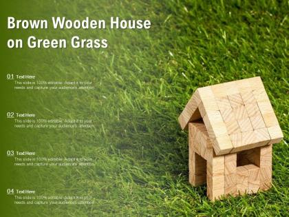 Brown wooden house on green grass