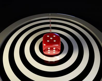 Bulls eye with dice in center target business concept stock photo