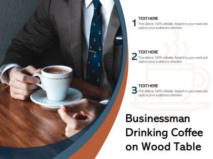 Businessman drinking coffee on wood table