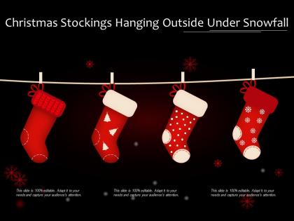 Christmas stockings hanging outside under snowfall