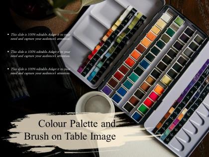 Colour palette and brush on table image