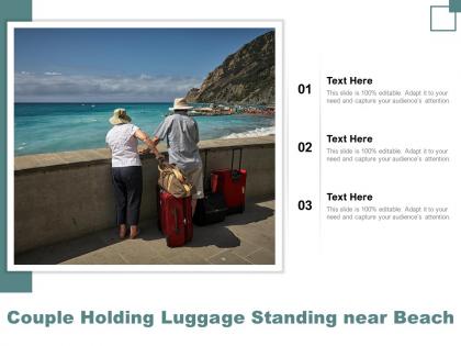 Couple holding luggage standing near beach