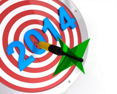 Dart hitting target for new year 2014 stock photo