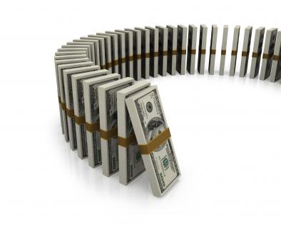 Dollar standing like a row of dominoes stock photo