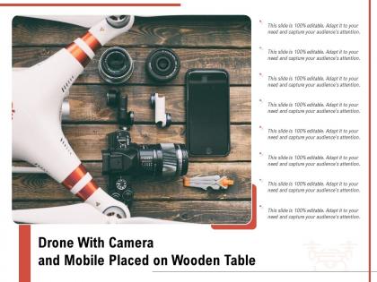 Drone with camera and mobile placed on wooden table