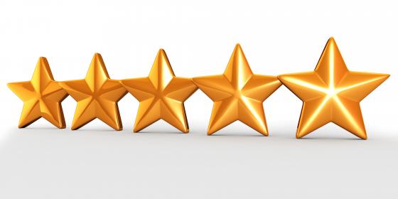 Five golden stars for quality check and assurance stock photo