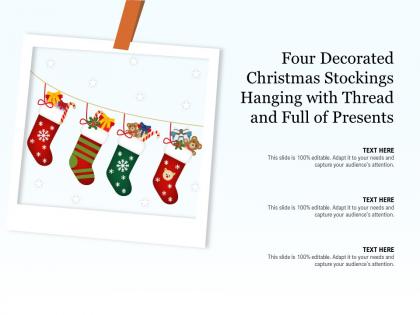 Four decorated christmas stockings hanging with thread and full of presents