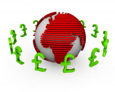 Globe surrounded by pounds displaying finance and business stock photo