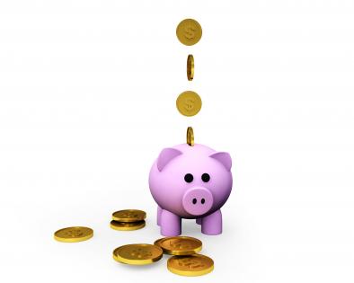 Gold coins and piggy for saving stock photo