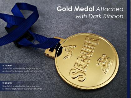 Gold medal attached with dark ribbon