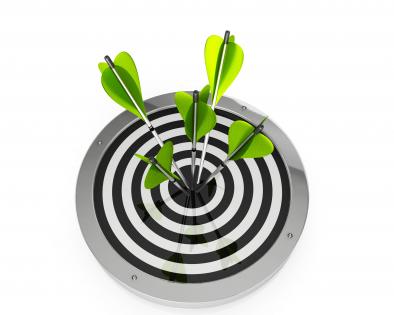 Green arrows hit on center of target board stock photo