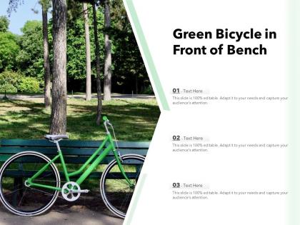Green bicycle in front of bench