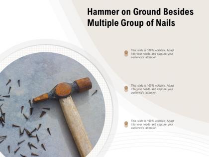 Hammer on ground besides multiple group of nails