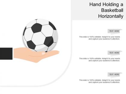 Hand holding a basketball horizontally