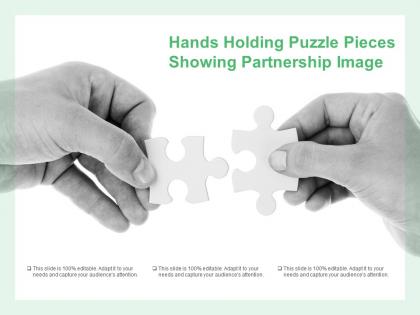 Hands holding puzzle pieces showing partnership image