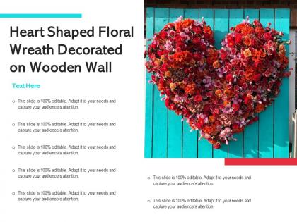 Heart shaped floral wreath decorated on wooden wall