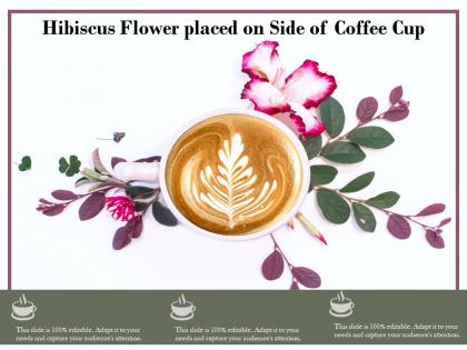 Hibiscus flower placed on side of coffee cup