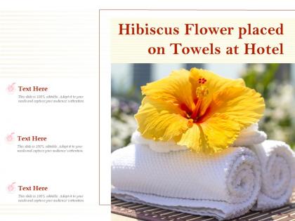 Hibiscus flower placed on towels at hotel