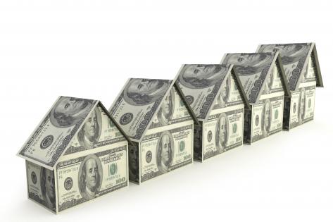 Houses in a row made by dollars stock photo