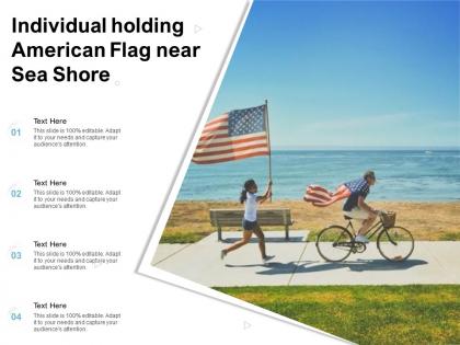 Individual holding american flag near sea shore