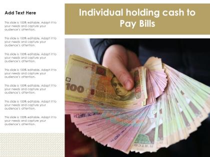 Individual holding cash to pay bills