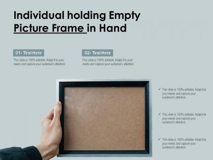 Individual holding empty picture frame in hand
