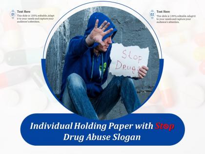 Individual holding paper with stop drug abuse slogan