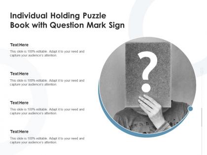 Individual holding puzzle book with question mark sign