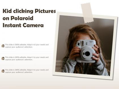 Kid clicking pictures on polaroid instant camera