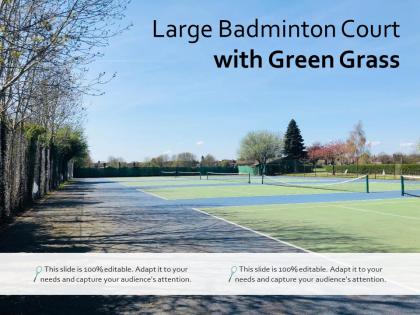 Large badminton court with green grass