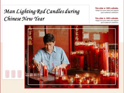 Man lighting red candles during chinese new year