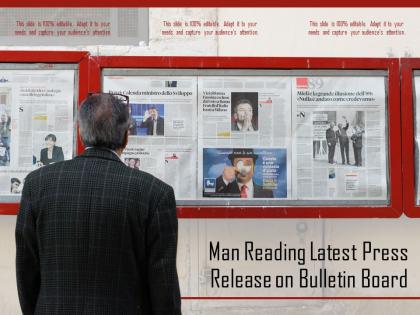 Man reading latest press release on bulletin board