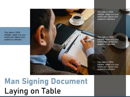 Man signing document laying on table