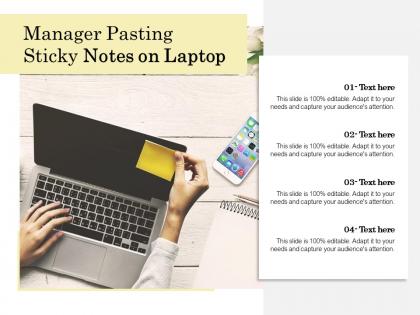 Manager pasting sticky notes on laptop