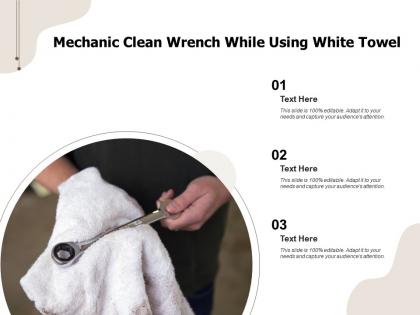 Mechanic clean wrench while using white towel