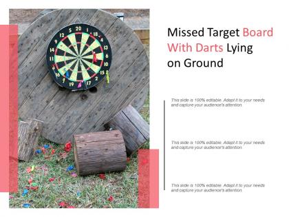 Missed target board with darts lying on ground