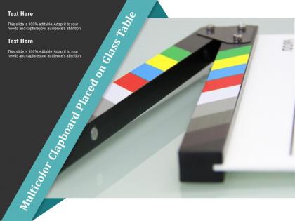 Multicolor clapboard placed on glass table