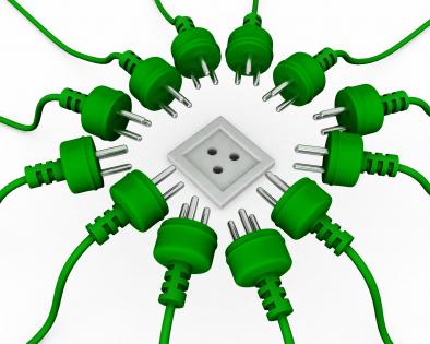 Multiple green plugs with one white socket showing business target stock photo