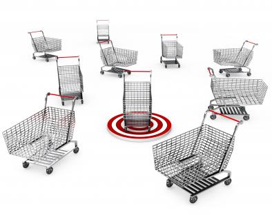 Multiple shopping carts with dart to show target of shopping stock photo