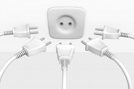 Multiple white cables for one socket for teamwork stock photo
